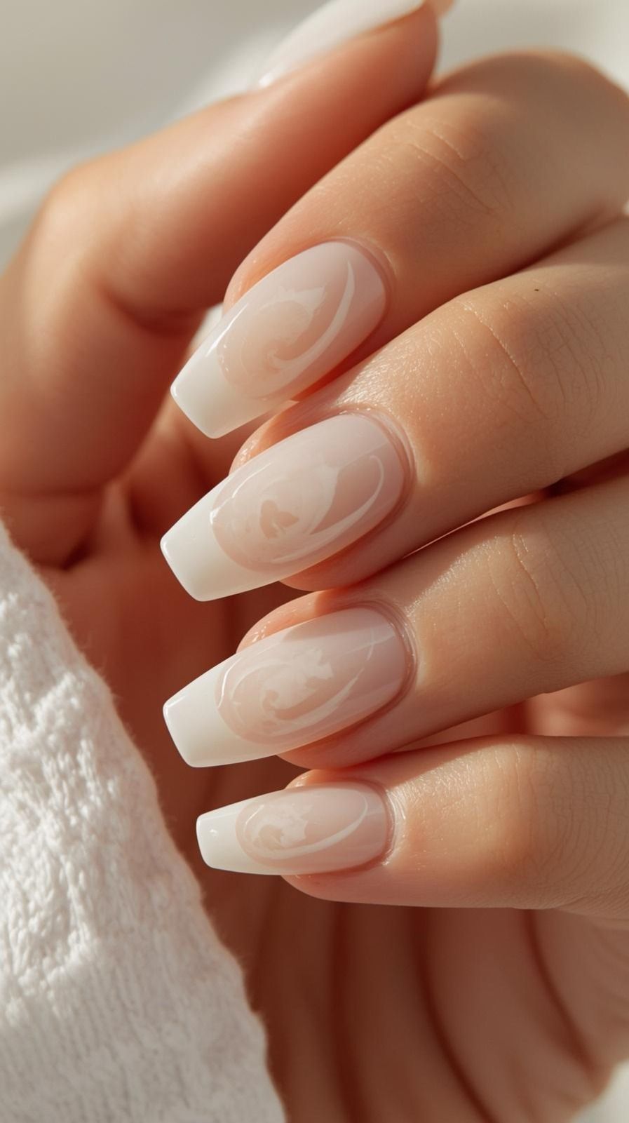 Elegant Milky White French Tip Nails with Abstract Swirl Art