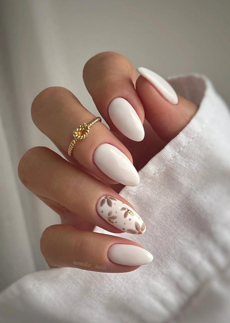 Elegant Milky White Almond Nails with Delicate Floral Accent