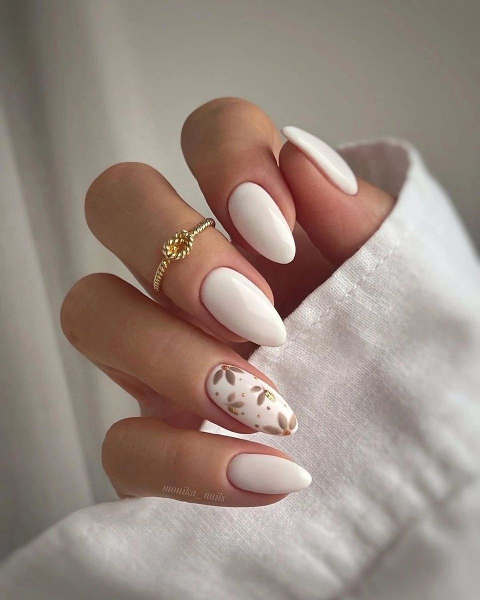 Elegant Milky White Almond Nails with Subtle Floral Accent