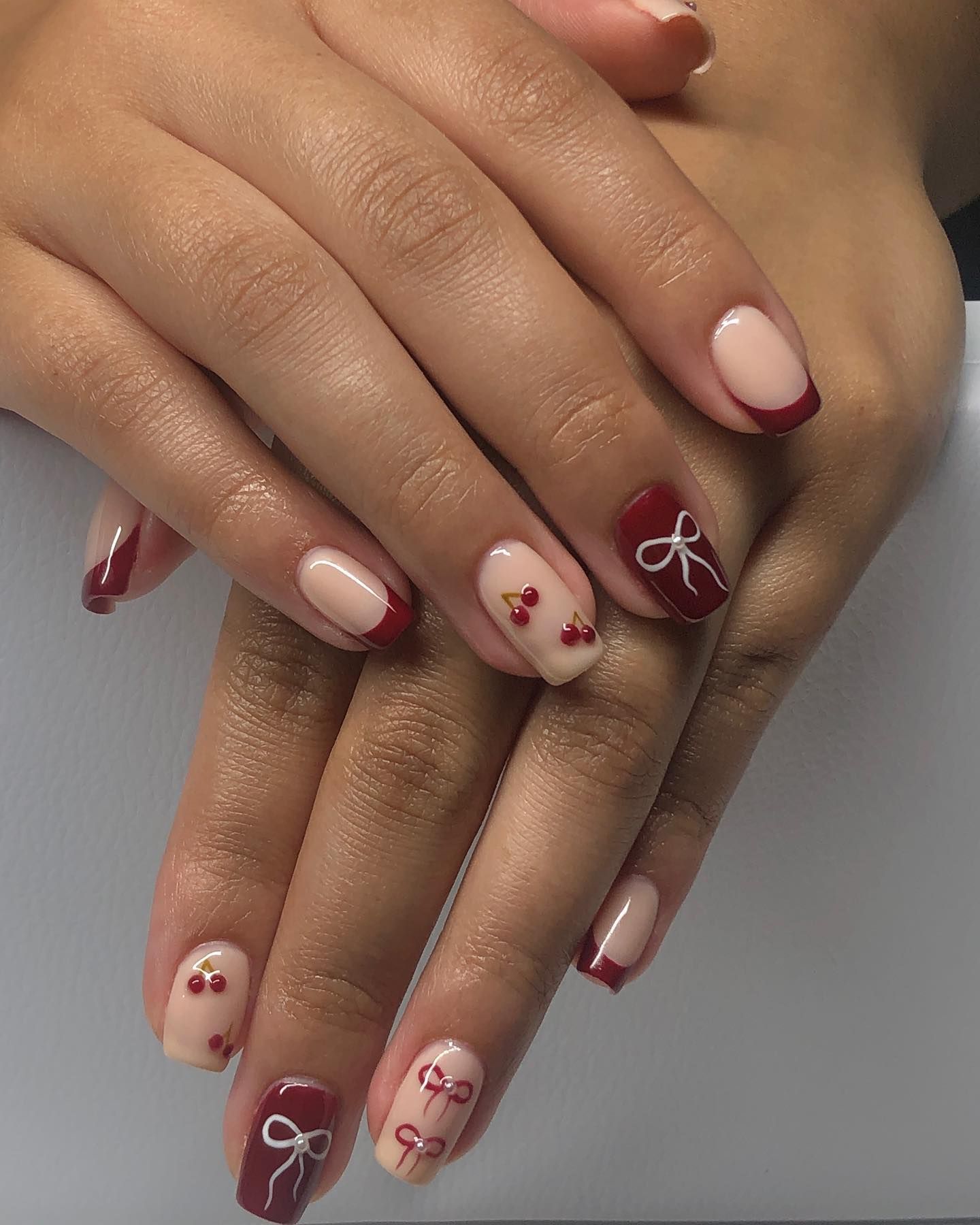 Chic Red French Tip & Bow Nail Art: Festive Nude Manicure Ideas