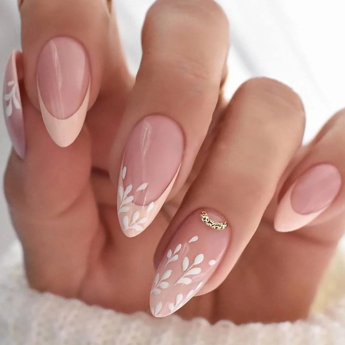 Elegant Nude & White Floral French Almond Nails with Gold Accent