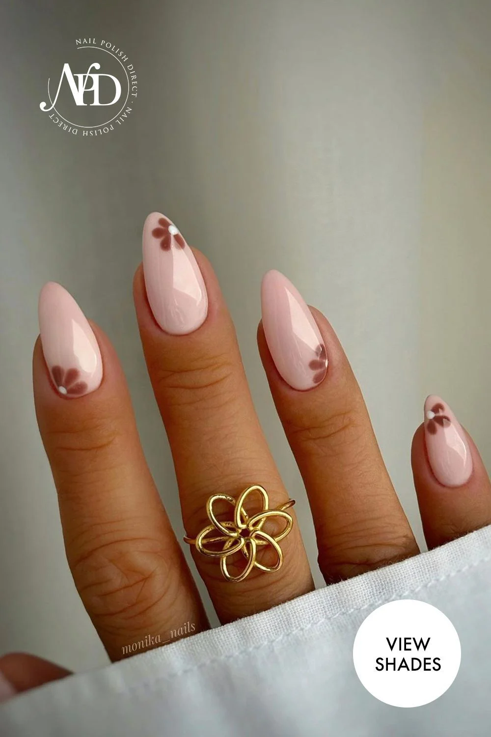 Soft Pink Almond Nails with Delicate Brown Floral Design