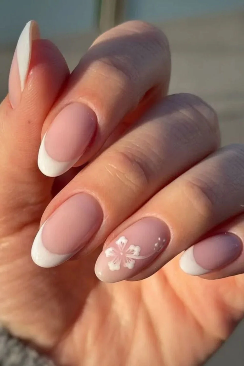 Elegant French Manicure with White Floral Accent Nails