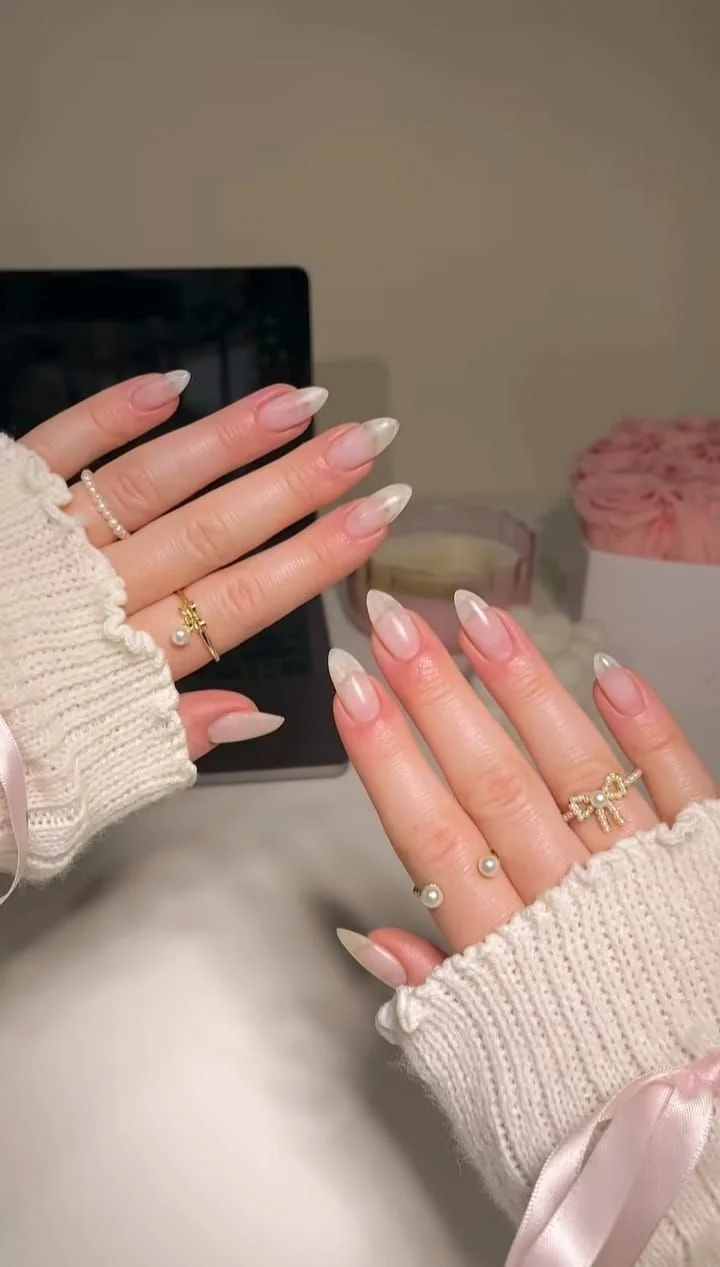 Elegant Sheer White French Tip Almond Nails for a Clean Girl Look